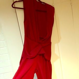 Brand New/never worn AQAQ jumpsuit w/ deep V front